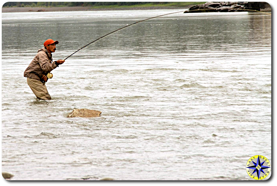 fly fisherman with stealhead on