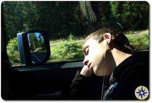 boy asleep in the passenger seat