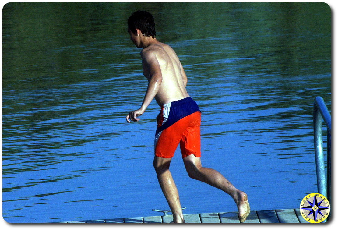 boy on swimming dock