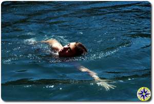 boy swimming lake