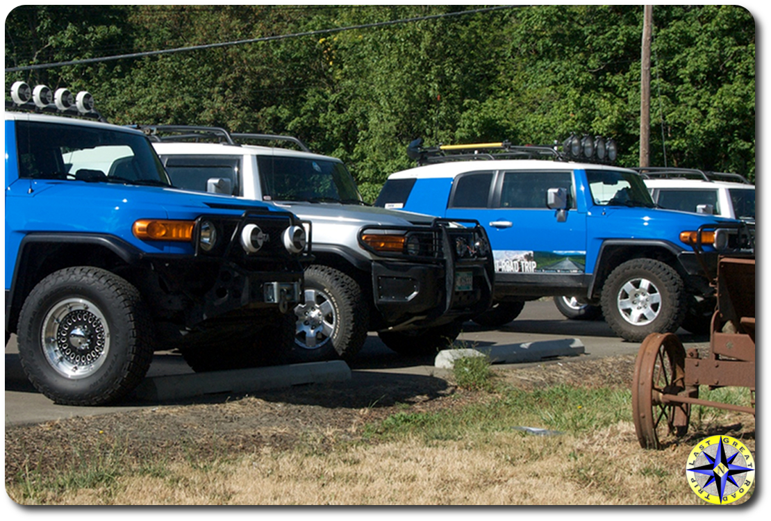 four fj cruisers parked