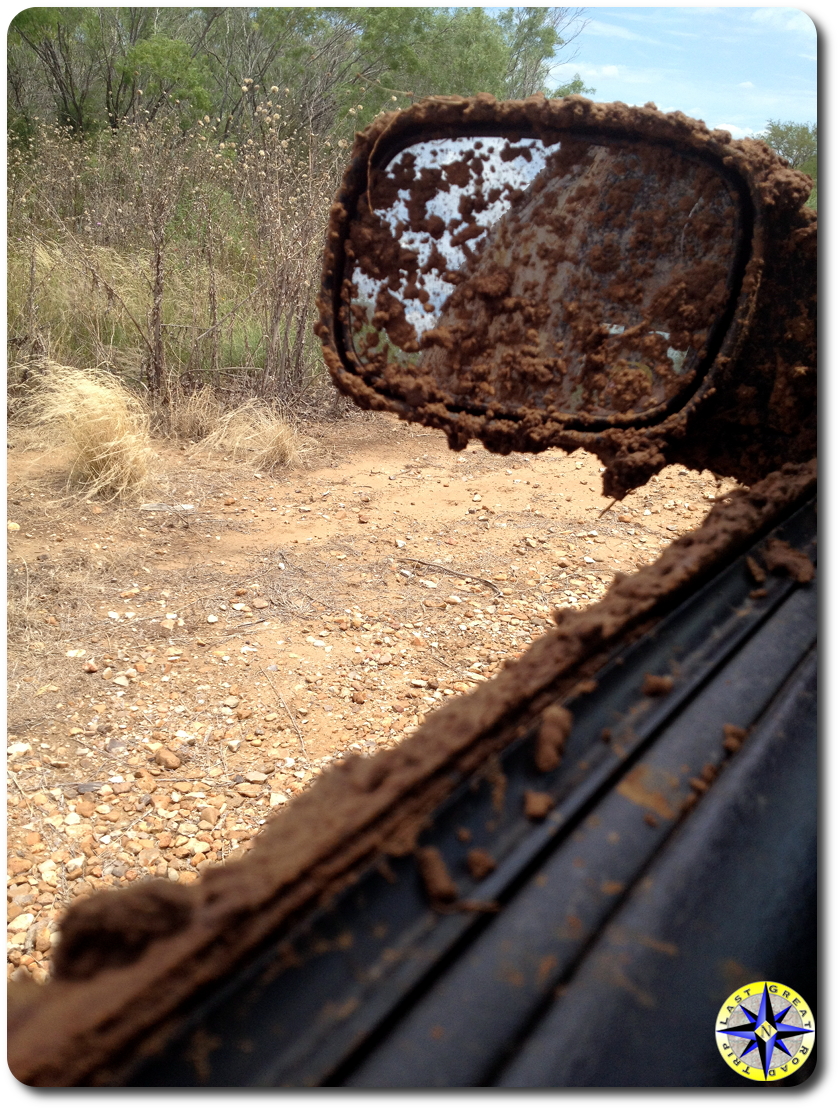 mud covered jeep mirror