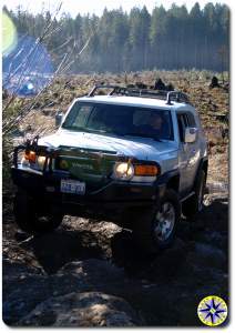 fj cruiser approaching rocks tahya forest