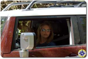 blonde woman driving FJ Cruiser