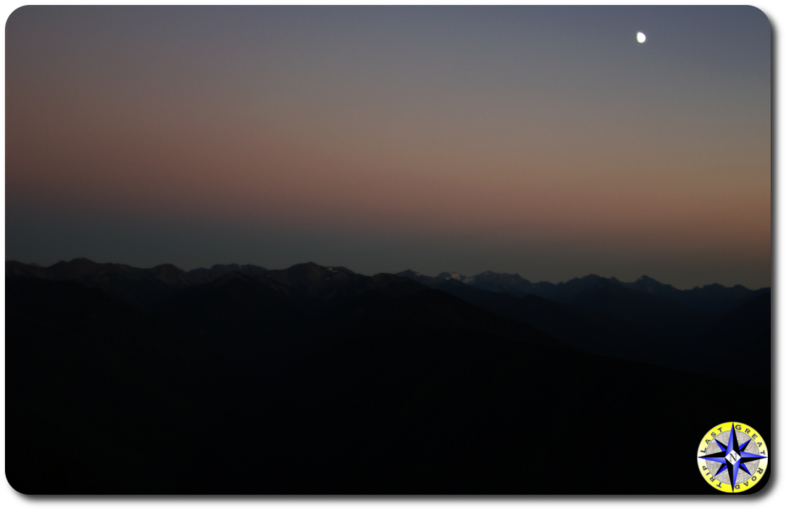 sunset with moon over olympic mountains