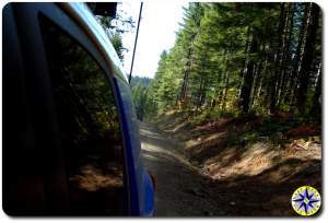 fj cruiser looking Back wooded trail