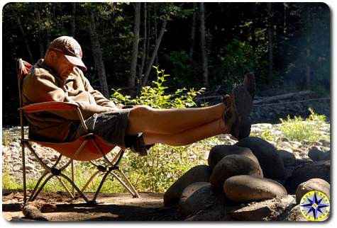 man sleeping camp chair morning sun