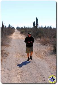 Man walking baja dirt road