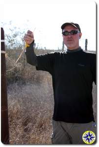 man holding baja 1000 race marker