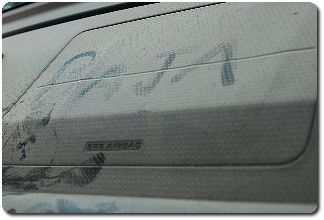 Baja writen in dust on dash