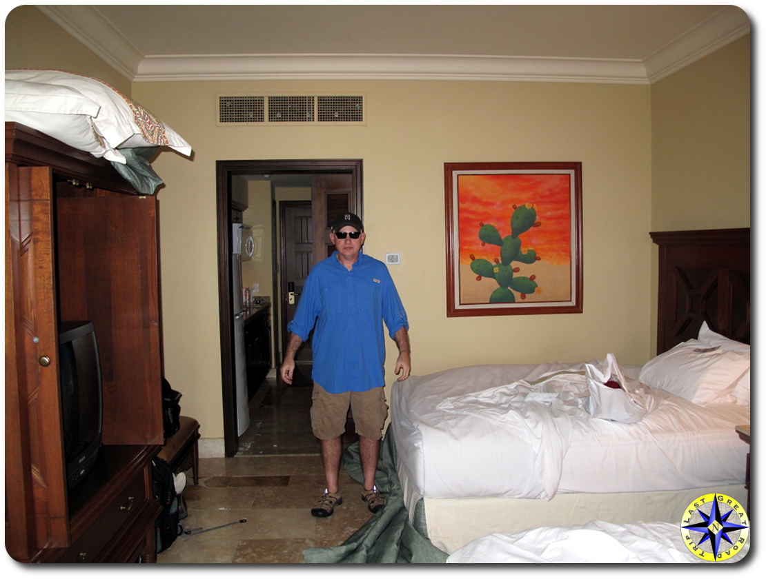 man standing in cabo hotel room