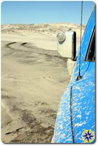 fj cruiser tire track in beach sand