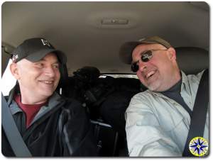 two laughing men driving fj cruiser