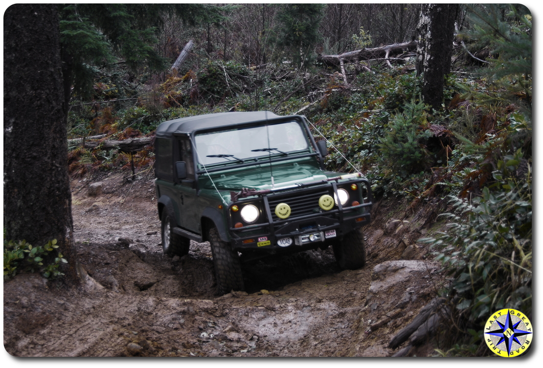 Landrover D90 climbing mudy hill