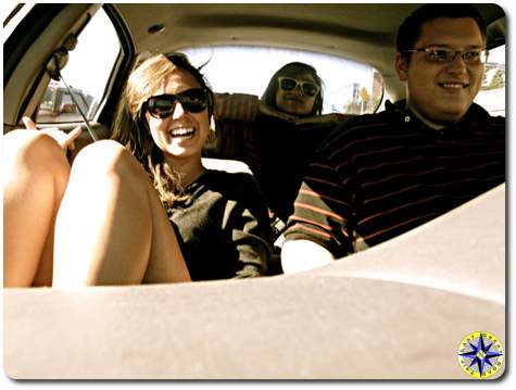 three college friends in car road trip