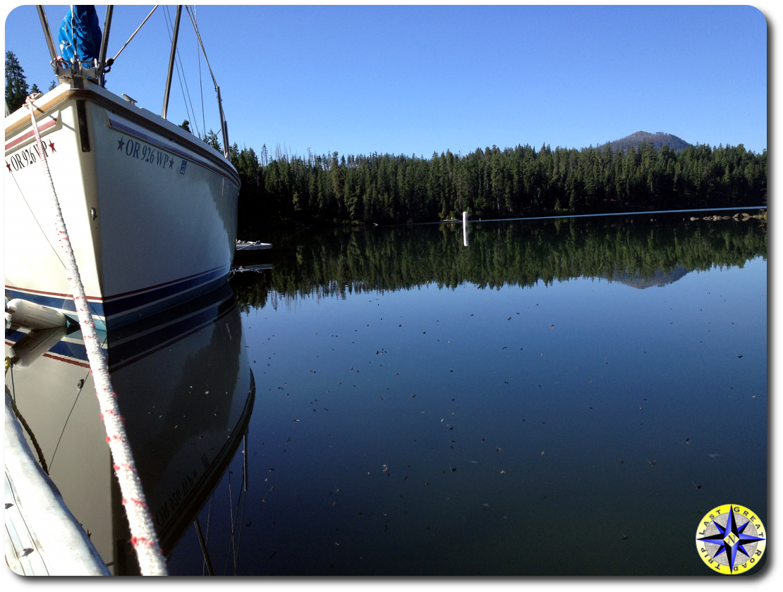 boat and reflection on suttle lake dock