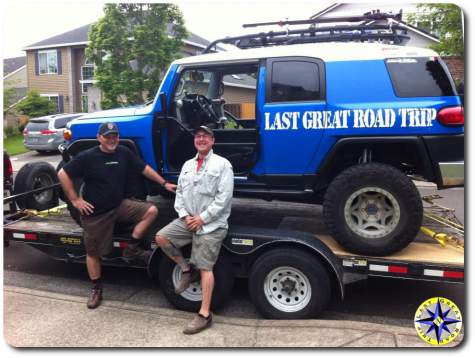 two men ultimate fj cruiser on trailer