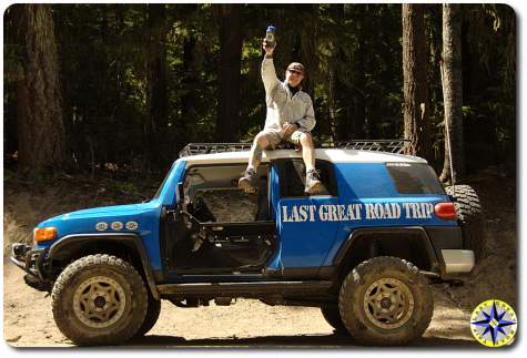 man on fj cruiser roof