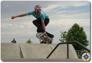 skateboard over rail