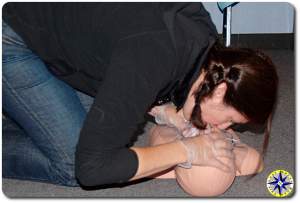 women demonstrates CPR