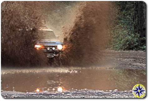 Toyota fj cruiser splashing muddy water