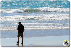 man walking pacific ocean beach baja mexico