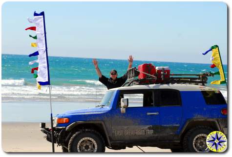 man fj cruiser baja mexico pacific ocean beach prayer flags