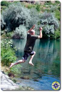 jumping into swimming hole
