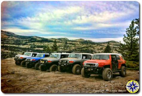 fj cruisers lined up on rubicon trail