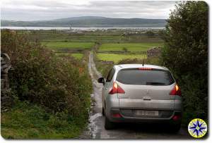 car on ireland country road